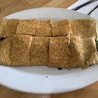 Bland, raw spinach stuffed crepe with unmelted cheese and tomato. Waited an hour. Big disappointment  at Crepes Bistro in Santa Clara