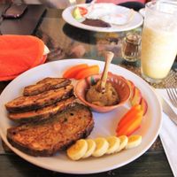 French toast with apple jam and fruit. Banana smoothie blended with water/ice in the background. at Xiguela Cafe in Oaxaca