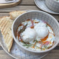 turkish style poached eggs with toasted bread for brunchh  at Piccola Cafe in Ljubljana