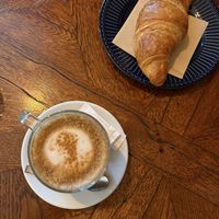 dirty chai latte and plain croissant   at Piccola Cafe in Ljubljana