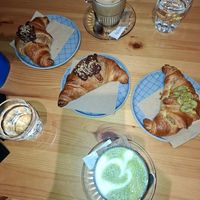 Pistachio croissant, chocolate croissant, matcha latte, cappuccino at Piccola Cafe in Ljubljana