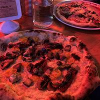my artichoke-based pizza with mushrooms, basil, peppers, tomatoes and additional aubergine.  In the back my mum's gluten-free pizza with vegan cheese. at Sano in Glasgow