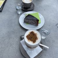 Sachertorte and almond-cinnamon-Cappuccino with oat milkk  at Konditorei Alexandra in Merano