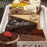 Tiramisu, Sacher, Nuss, Chocolate, pistachio, mango and Black forest cakes 😍 at Konditorei Alexandra in Merano