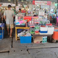 The husband running the place with his wife cooking the goods at Khanomchin Che Kai - Food Stall in Koh Samui