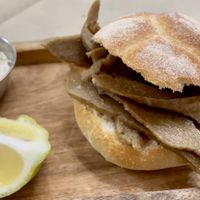 Pane ca’ “veusa” with grated vegan “ricotta salata”  at In Cottura - Home Vegan Restaurant in Palermo