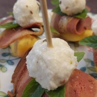 Frutta , mozzarella di anacardi e crudo . at In Cottura - Home Vegan Restaurant in Palermo