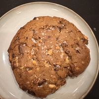 Big chocolate chip and walnut cookie - right out of the oven. Large enough to split four ways!  at Oleum in Baltimore