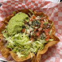 It has refried beans, mushrooms , bell peppers and potato at the bottomm  at Giliberto's Mexican Taco Shop in Moab
