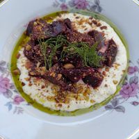 Roasted beetroot with "Labneh" and roasted almonds and dill infused oil. at Barbarella PLANT Bistro in Ljubljana
