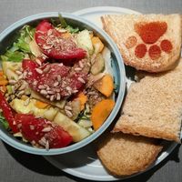 Insalata (salad) with (white) bread toasted on one side. The salad is basic and made with a simple vinnegrait at Katzentempel - Trier  in Trier