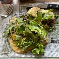 Naan with hummus, grilled veggies, arugula, vegan cheese  at Bospaviljoen De Norgerberg in Norg