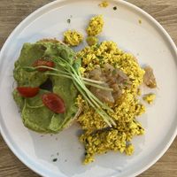 Bagel 1/2 avo mash 1/2 tofu scramble  at Vegan Backyard in Berlin