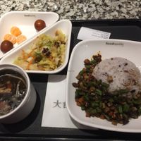 platter contains cabbage salad, seaweed soup fruit, and main dish of rice and carrot/okra/tofu cubes cooked in mild sauce at Yi Tian Yi Su - Taiguhui in Guangzhou