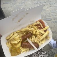 Vegan sausages and chips with curry sauce   at Lyme's Fish Bar in Lyme Regis