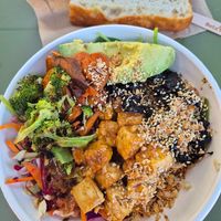Spicy harvest bowl $18.50 Fitzroy location (roast tofu, mushrooms, spinach, slaw, sweet potato, avo, brown rice, broccoli, w/spicy peanut dressing): DELICIOUS and healthy at Greenstreat in Melbourne