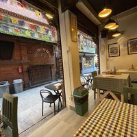 Inside the restaurant. There’s probably about 7 tables all up.   at Vera Pizza in Kathmandu