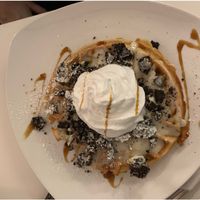 Waffle with vanilla pudding, oreos and cream at Creperie Lamara in Hannover