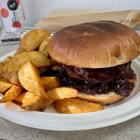 Vegan burger (meat-like)  with fried potato wedges  at Mentor Coffee Guidance & More in Milos