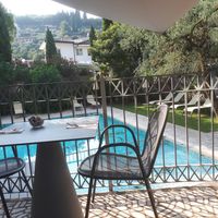 Sitting area outside by the pool at Gabry in Riva Del Garda