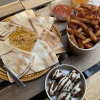 Baked carrot hummus, fries and homemade beer ketchup, and some falafels   at Brasserie Du Singe Savant in Lille