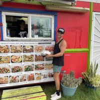 Menu pic with owner   at Thai Food Truck Express - Punalu'u in Hauula