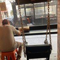 This is all the inside seating--just a stool and a swing. at Wolfnights in New York City