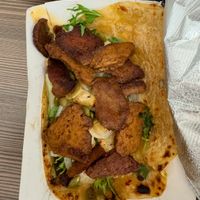 Himalayan wrap-Grilled Seitan & kohlrabi wrapped in ginger dough with spicy pickled pineapple, sumac onions, cilantro, toasted pumpkin seed, and vegan red chili aioli at Wolfnights in New York City