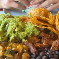 Chips, Guacamole, Beans, Fajita, Vegan meat, Mexican rice, Lettuce etc in the bowl.   at Dolores Burritos in Berlin