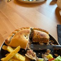 Sorry that the food is half eaten, I was hungry lol but still wanted you to see the inside of the pasties (full of filling😄) and the shared chips and salad. at Crank Cafe @ Crank Studios in Morley