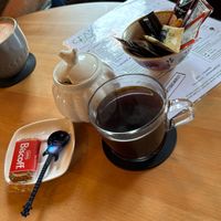 Guitar shaped teaspoon and an americano plus hot chocolate. at Crank Cafe @ Crank Studios in Morley