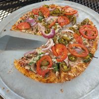 Medium pizza with non-dairy cheese (Violife), jalapenos, spinach, red onions, and mushrooms. at Marietta Pizza Co in Marietta