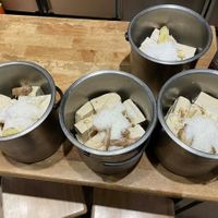 pots of tofu being prepped for cooking at Miao Guanyin - 妙觀音素食 - Zhongzheng District in Taipei