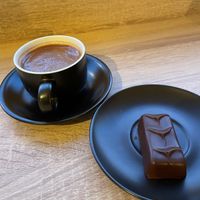 Cup of hot chocolate and a chocolate nut barr  at Gemini Chocolate in Beverley