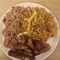 Takeaway: chickpea curry, rice & peas, fries with a side of fried plantain at Jerk Junction Wilmslow in Wilmslow