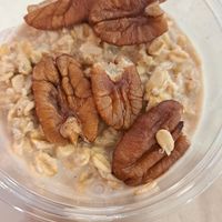Overnight oats woth PB , pecans and banana at DXB - Flour + Stone - T3 - A & B in Dubai
