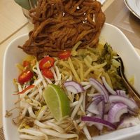 Wok curry noodles with mungbeans, chili, lime, onions, cabbage and seitan. And a deep fried noodle crispy. at Sweety Siam in Bad Aibling