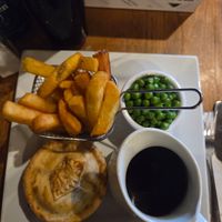 notdog pie with chips,  peas,  and gravy at The Happy Cheese in Ashurst