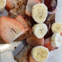 Vegan coconut banana French toast with strawberries added!  at Griddle 145 in Allentown