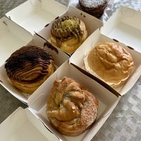 2 cinnamon roll (pistatxo & txokolate), bomba bat, rollo de cardamomo, pastas de higos.  at AMONA Basque Vegan food in Pamplona