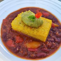 Chili, polenta and guacamole 🤤 at Hotel Restaurant du Cerf in Soubey