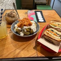 House-made ginger ale, kimchi patatas bravas, "banh mi". at Quinoa in Barcelona