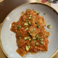 Ravioli di seitan con pomodoro al basilico e formaggio di mandorle   at Una Gemma in Turin