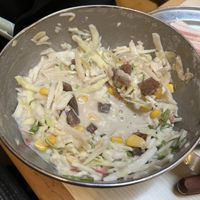 Vegan okonomiyaki mix with konyaku yam, seaweed stock, sweetcorn, pickled ginger, cabbage, green onion, etc brought to the table and mixed in front of you before cooking    at Abeno in London