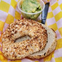 Onion ans garlic bagel and avocado at Galveston Bagel Company in Galveston