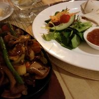 Mixed Vegetable Tikka Sizzler with tortilla wrap, mango chutney and salad at Playwrights in Coventry