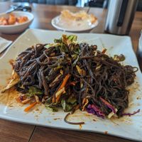 Jaengban Guksu after mixing at Surinnal Seolleongtang Halmae Jokbal Bossam in Seoul