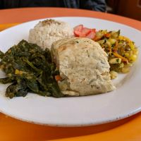 Rice, spinach, potato roll filled with seitan and veg, corn salad, picked radish. Yum. at Quinua in Quito