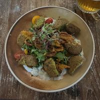 Double portion of falafel starter as main. Hummus is under the greens.  at Tweedies Bar & Lodge in Grasmere
