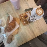 plain croissant - strawberry smoothie - pastel de nata - cappuccino oat milk  at GAL Cafe in Lisbon